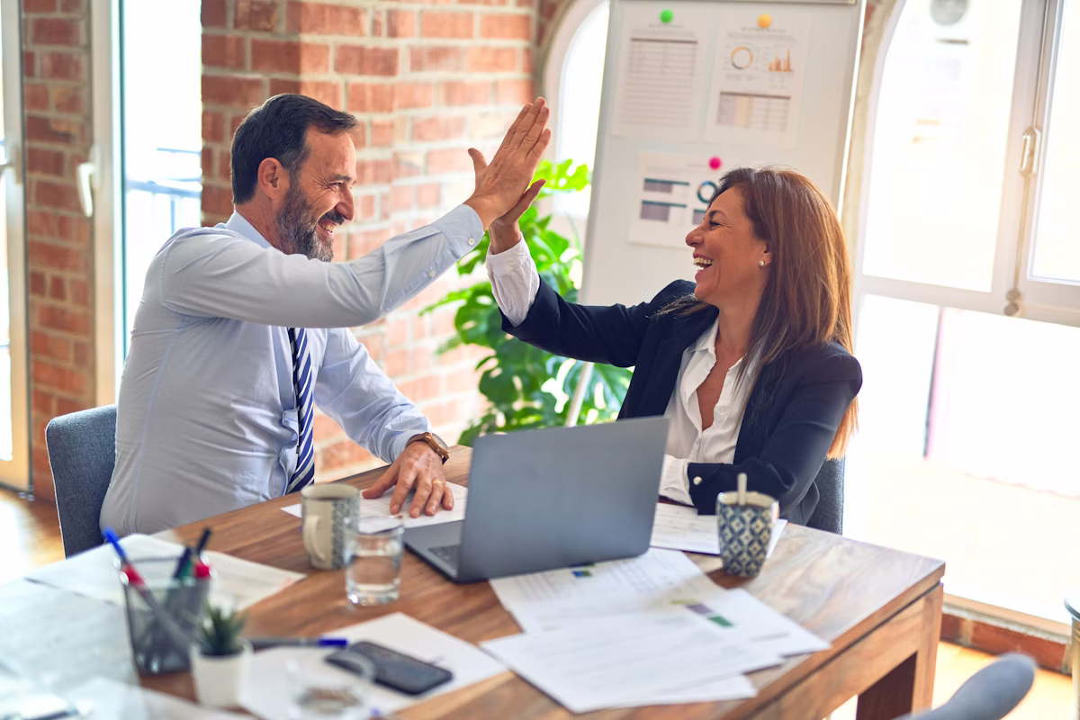 Professional team reviewing loan documents in office